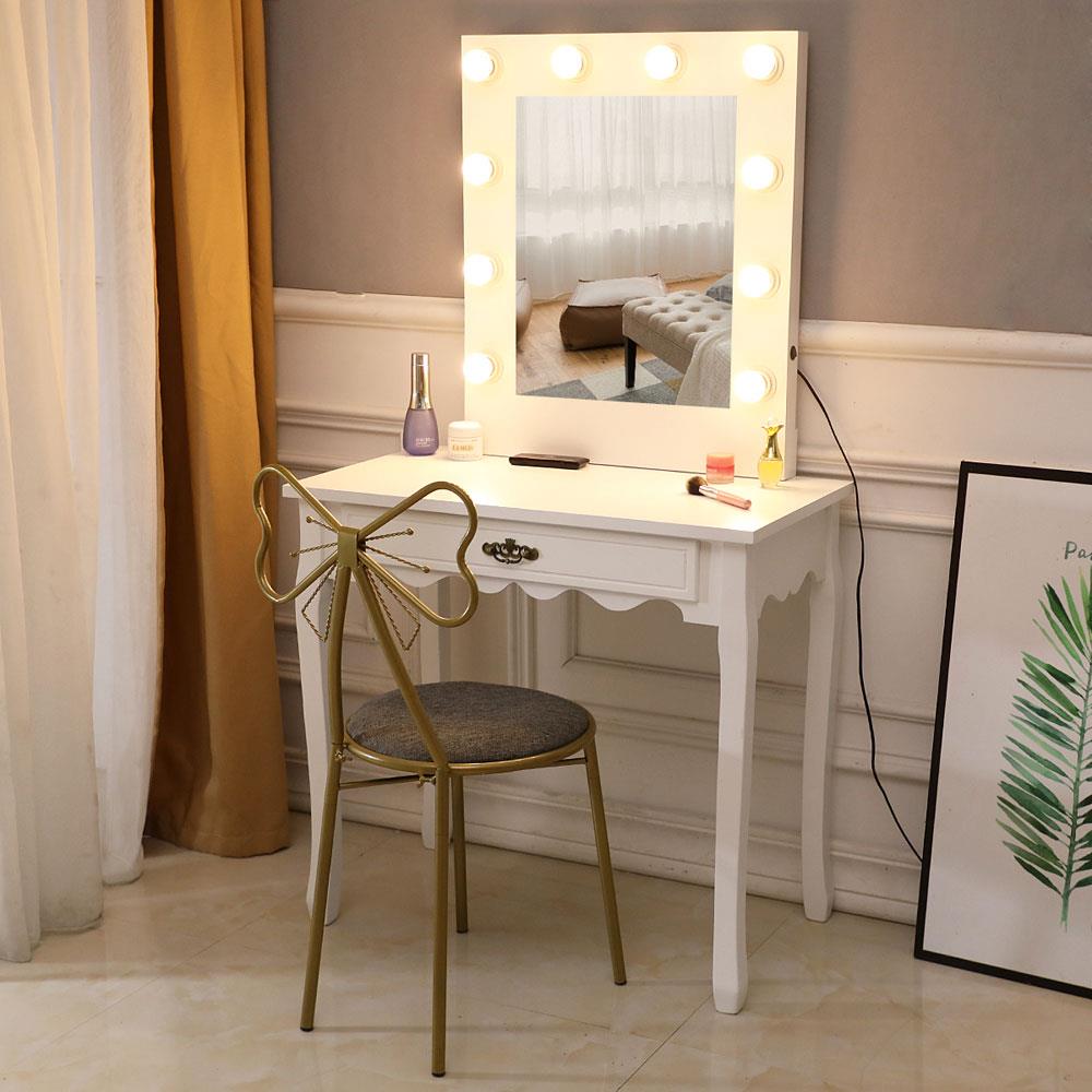 white vanity set with lighted mirror