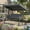 Gray, variant on Resenkos Outdoor Gliding Seating for Backyard, Detachable Cushions Side Pockets 3-Person Patio Canopy Swing, Brown