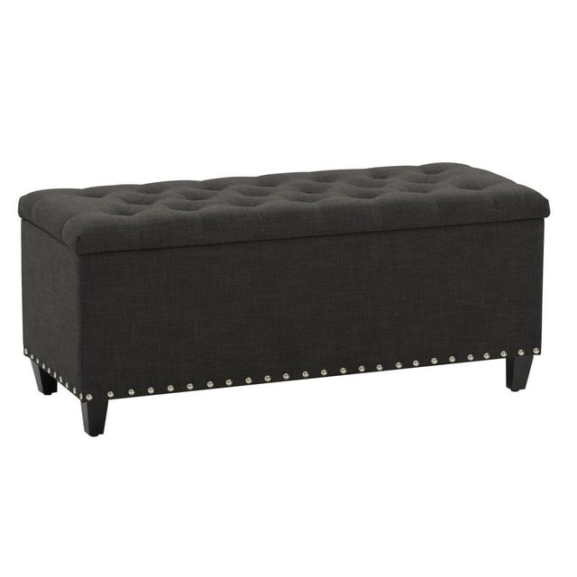 Dark gray CorLiving Boston tufted fabric storage ottoman with nailhead trim and wooden legs.