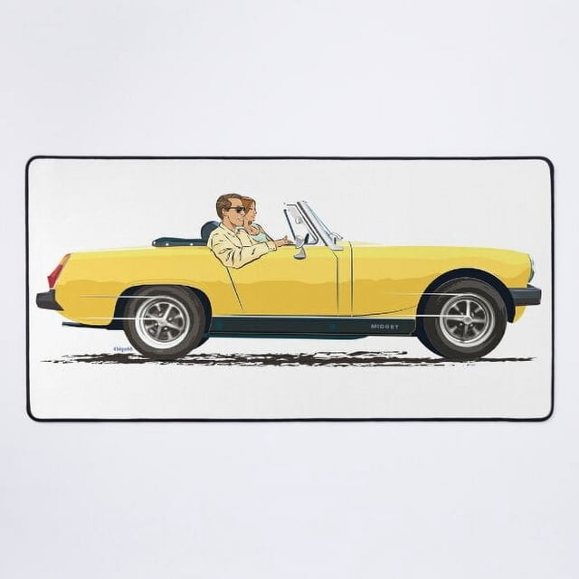 Un NUEVO Midget Mk3 de color amarillo Inca con protectores de goma y alfombrilla de escritorio