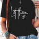 thumbnail image 1 of Women's 100% Graphic T-Shirt - Casual Short Sleeve Round Neck Top with inspirational Quotes "Let Them" & "Keep Shining" , Perfect for Spring & Summer, inspirational Clothing | Graphic Tee |, 1 of 6