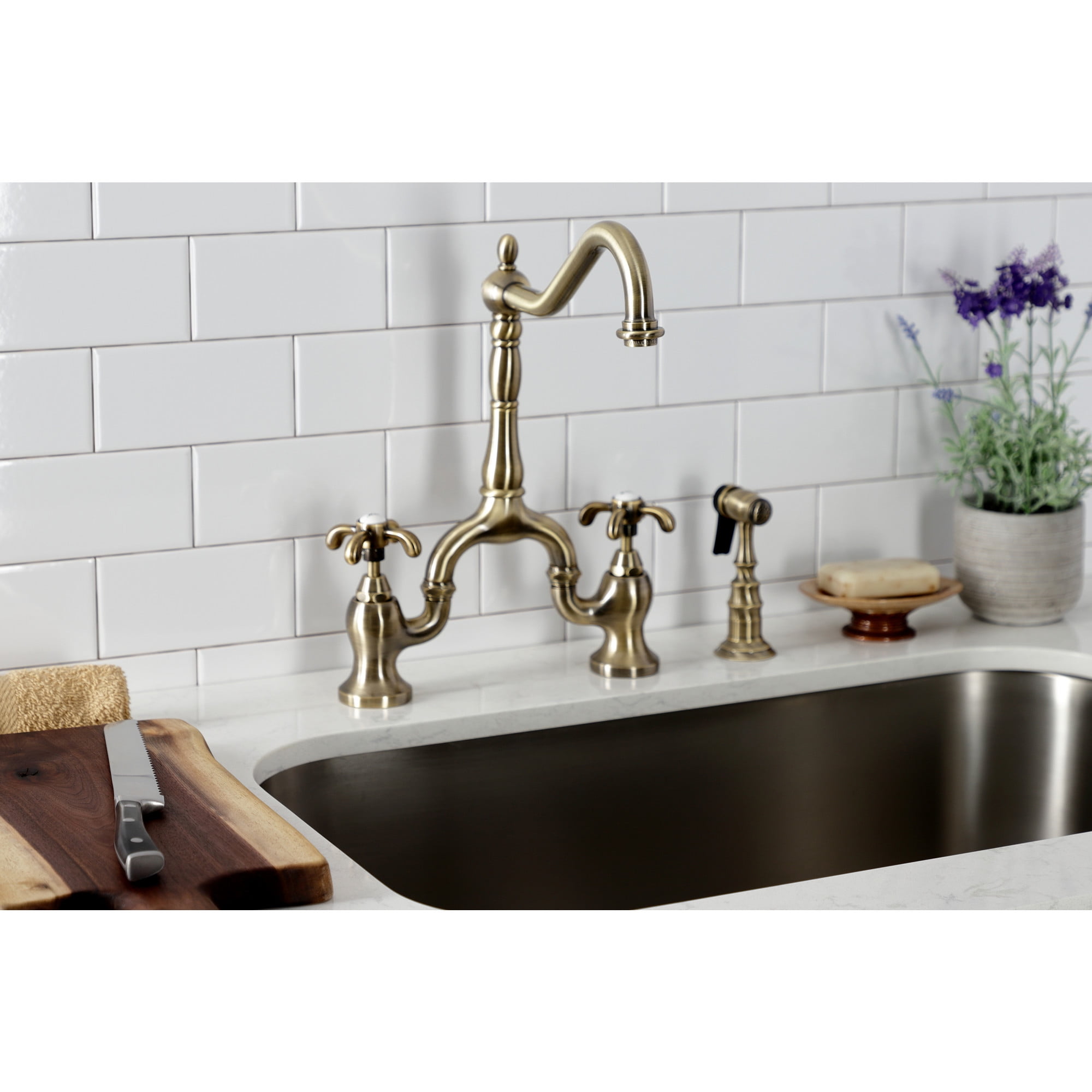 Kingston Brass KS7753TXBS French Country Two-Handle 3-Hole Deck Mount Bridge Kitchen Faucet with Brass Side Sprayer in Antique Brass