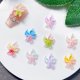 thumbnail image 2 of Colgantes para uñas UEYRSEDB, 80 unidades, 3D, con forma de flor hawaiana, hielo luminoso, 2 of 6