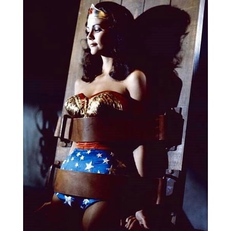 Lynda Carter as Wonder Woman Diana Prince shackled to board 8x10 inch photo