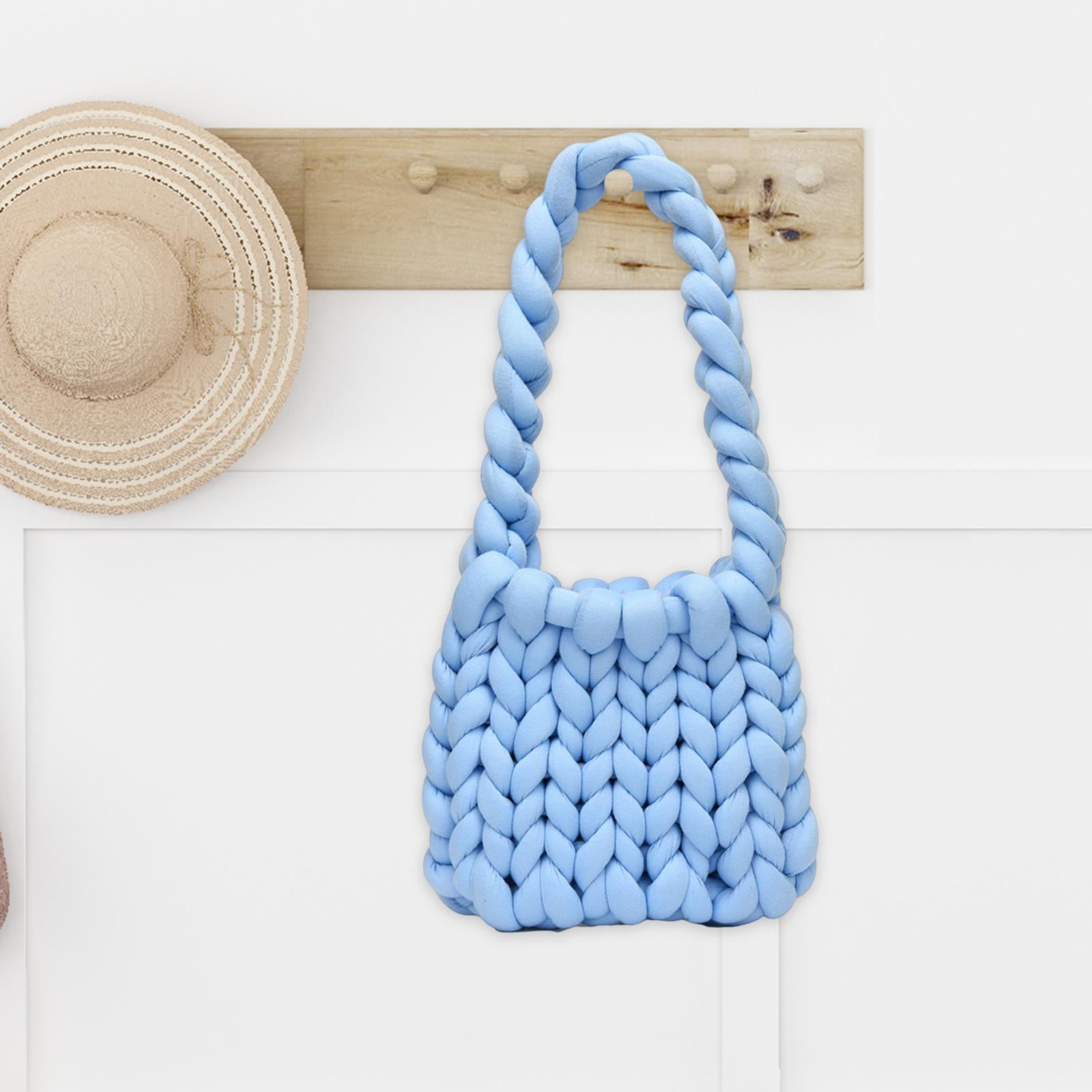 Premium Photo  Women's hands crocheting a bag from knitted yarn. flatley  from scissors, centimeter, hook, yarn.