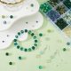 thumbnail image 3 of 1 caja de 22 cuentas de vidrio verde surtidas con motivos navideños de primavera, espaciadores, biconos, para el Día de San Patricio., 3 of 9