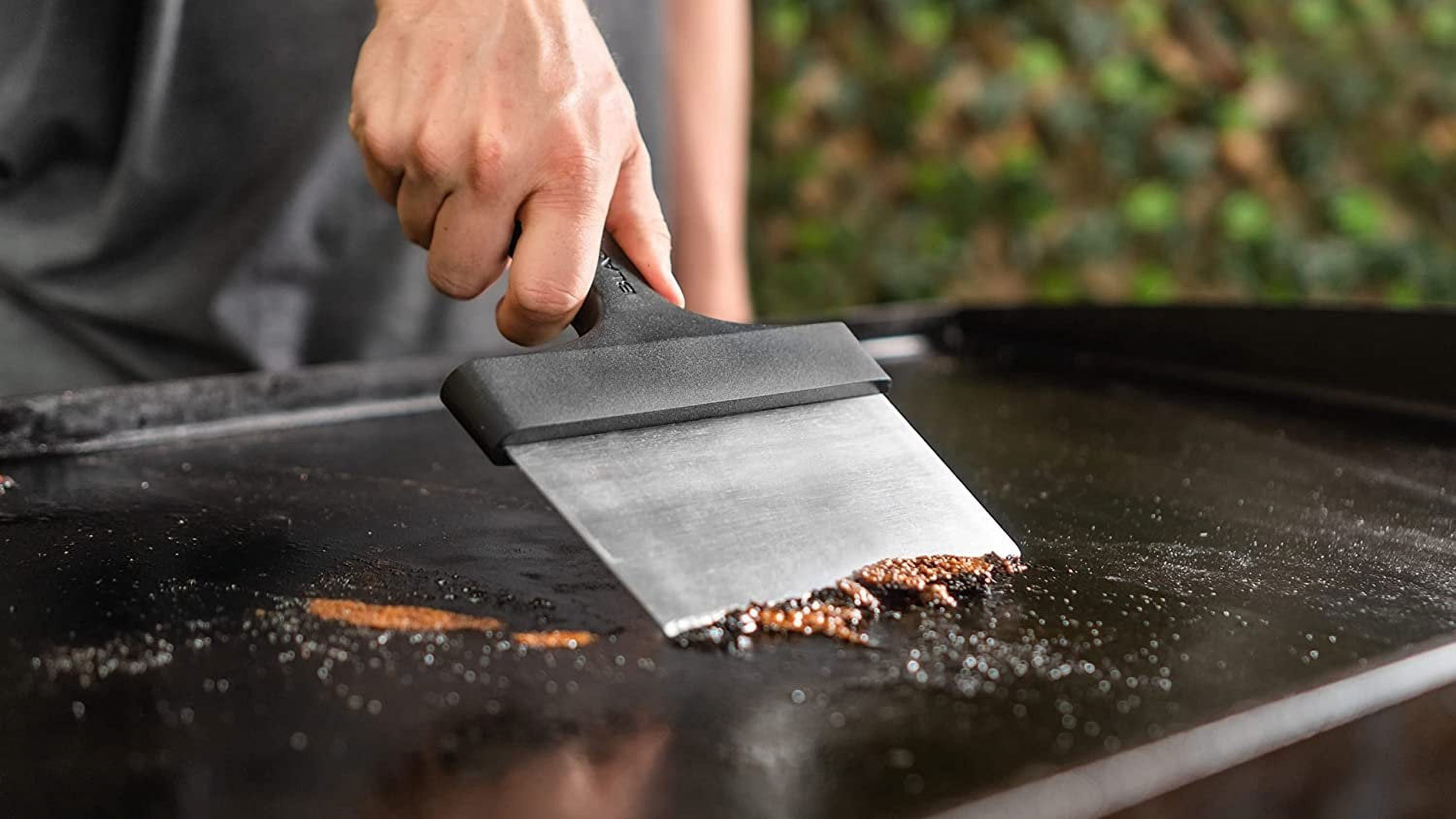 Blackstone griddle metal bench scraper in action warm surface