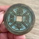 thumbnail image 3 of Exquisitely crafted antique-style copper coins, including those depicting mountain spirits, Laozi (the Supreme Lord Lao), and high-relief auspicious symbols of good fortune and longevity., 3 of 4