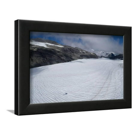 Shadow of helicopter flying over glacier, Mount Aspiring National Park, West Coast, South Island... Framed Print Wall