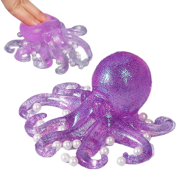 new transparent octopus stress relieving toy for children, slow rebounding toy gift Morado nuevo pulpo transparente morado de alivio de estrés, vista 3/4 con cabeza redondeada y ocho tentáculos rizados con brillo y cuentas blancas incrustadas; inserto muestra un dedo presionando la parte superior para revelar rebote lento; aprox. 13 cm (5.1 in), material PU, fondo blanco, ideal como juguete sensorial o fidget de viaje.