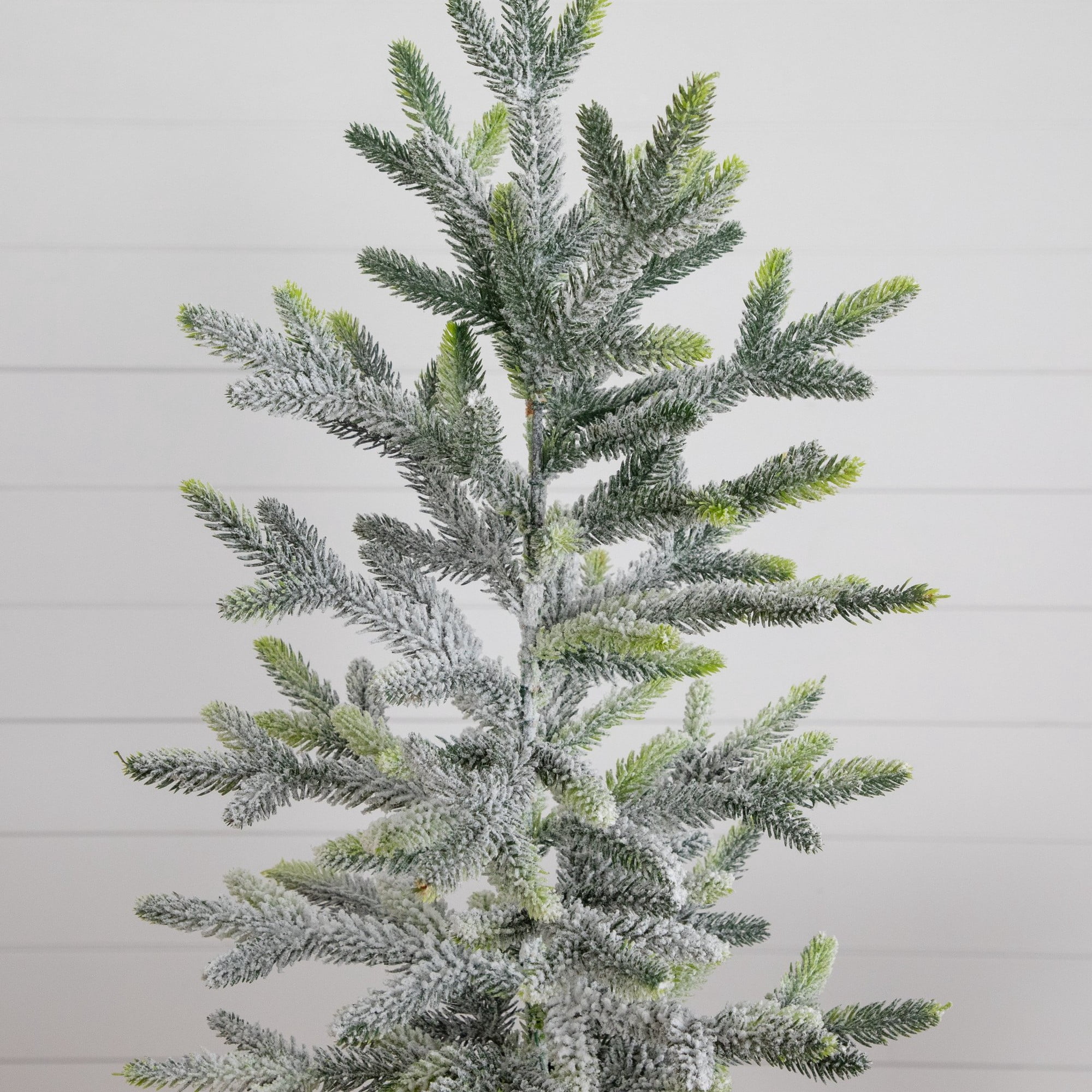 2ft. Artificial Frosted Christmas Tree in Black Decorative Urn