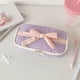 thumbnail image 4 of Estuche de lápices suave de estilo caramelo para niñas, bolsa de almacenamiento de papelería con lazo, estuche vertical de gran valor, 4 of 5