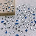 thumbnail image 1 of Juego de 150 diamantes de imitación de cristal para uñas, diamantes de imitación 3D de múltiples formas con fondo plano, para decoración de uñas, manualidades, teléfonos, ropa, joyas, bolsos, 1 of 6