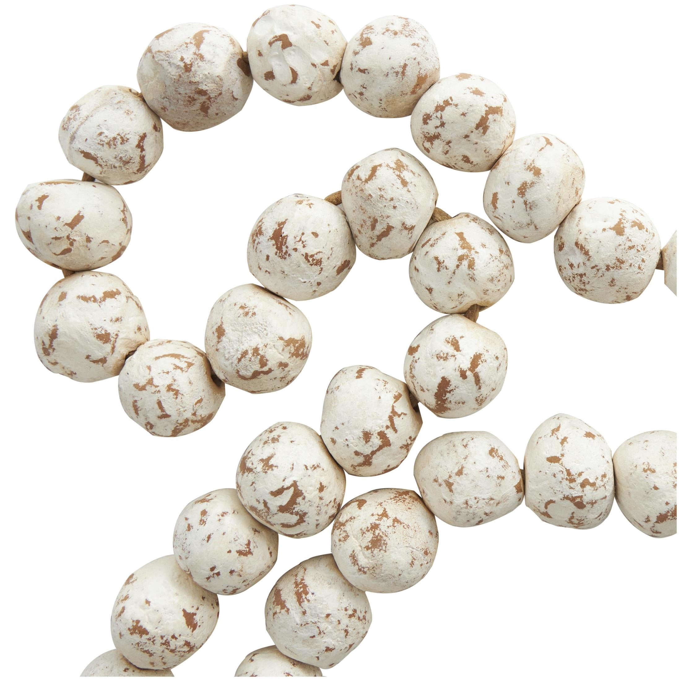 DecMode Handmade Round Intricately Shaped Large Distressed White Ceramic Garland with Tassel