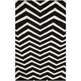 thumbnail image 1 of Safavieh Cambridge 2'6" X 8' Hand Tufted Wool Rug in Black and Ivory, 1 of 3