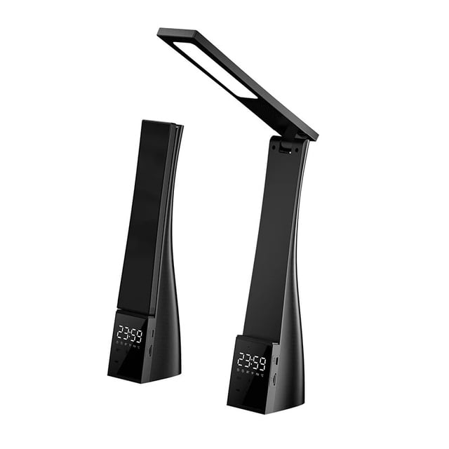lámpara de escritorio banyuo con reloj despertador bluetooth carga usb lámpara de escritorio negra con brazo plegable y panel LED, base tipo cuña con pantalla digital de reloj, controles táctiles y puerto USB visible, carcasa ABS satinado, regulable con tres temperaturas de color y atenuación continua, soporte para teléfono integrado; adecuada para estudio o recámara y también frecuentemente usada como soporte nocturno para celular.