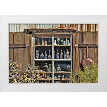 Paulson Don 14x11 White Modern Wood Framed Museum Art Print Titled - CA Randsburg Bottles in window of a store