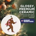 thumbnail image 4 of Sasquatch Carrying A Flamingo Christmas Ornament - Funny Quirky Bigfoot - Neanderthal - 2.8" Round Ornament - Gold String Included - UV Printed Design - Glossy Ceramic - BMCO0818, 4 of 7