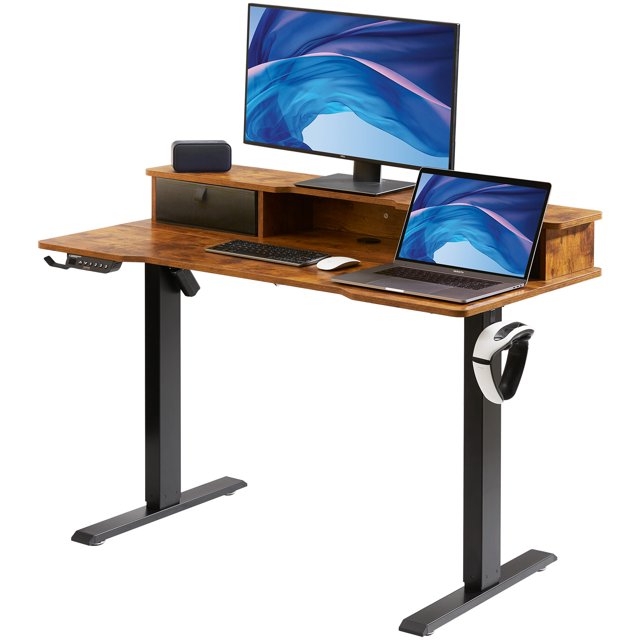 VEVOR height adjustable desk with a 47.2 x 23.6-inch brown desktop and black metal legs, featuring an electric dual monitor riser workstation. The desk includes a raised shelf for monitors, a spacious lower surface for a laptop and keyboard, and side hooks for accessories. It offers height adjustment from 28.3 to 45.1 inches with 3 memory presets and supports up to 180 lbs. Anti-collision technology and child lock features ensure safety. Ideal for home offices or workspaces.