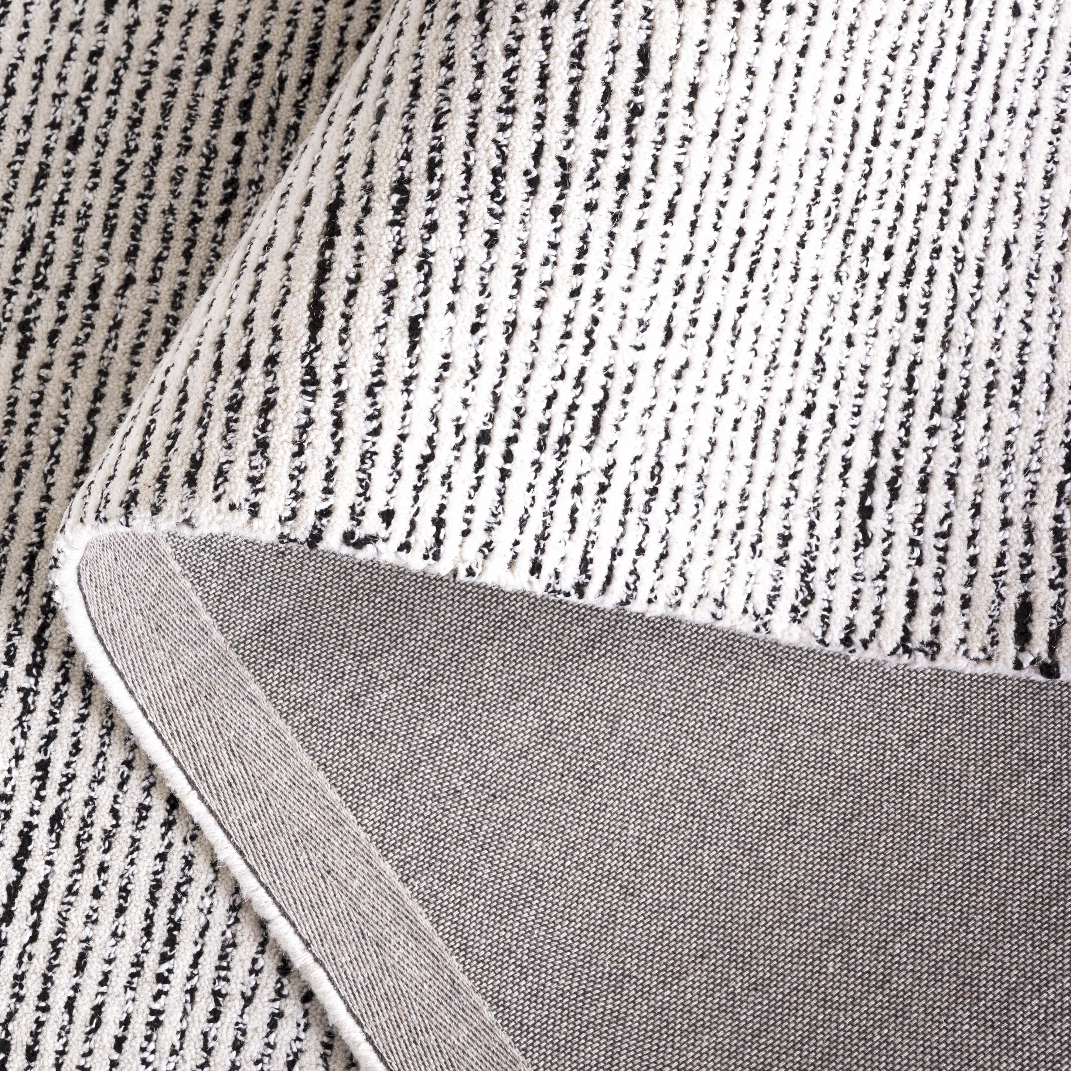 SAFAVIEH Abstract Rumen Solid Color Area Rug, Ivory/Black, 3' x 5'