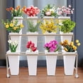 thumbnail image 3 of White Metal Flower Stand 3 Layers Indoor Outdoor Flower Display Shelf with Wheels, 3 of 11