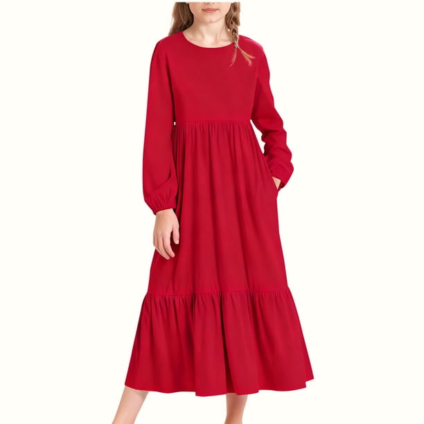 Vestido infantil de poliéster de manga larga, cuello redondo, bolsillos laterales y falda larga.
