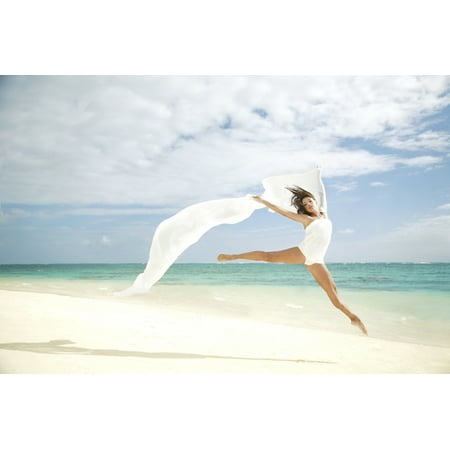 Hawaii Oahu Lanikai Beach Beautiful Female Ballet Dancer Leaping Into Air On Beach With White Flowing Fabric
