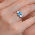 thumbnail image 4 of Gem Stone King 10K White Gold Swiss Blue Topaz White Moissanite and White Lab Grown Diamond 3 Stone Engagement Ring for Women (2.34 Cttw, Gemstone Birthstone, Available in Size 5, 6, 7, 8, 9), 4 of 5