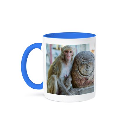 Myanmar. Mt Popa. Rhesus Macaque Resting Next To A Temple Guardian., 11oz Two-Tone Blue Mug