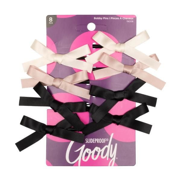 Eight Goody Ribbon Mini Bow Slides in black, beige, and cream colors displayed on purple branded packaging