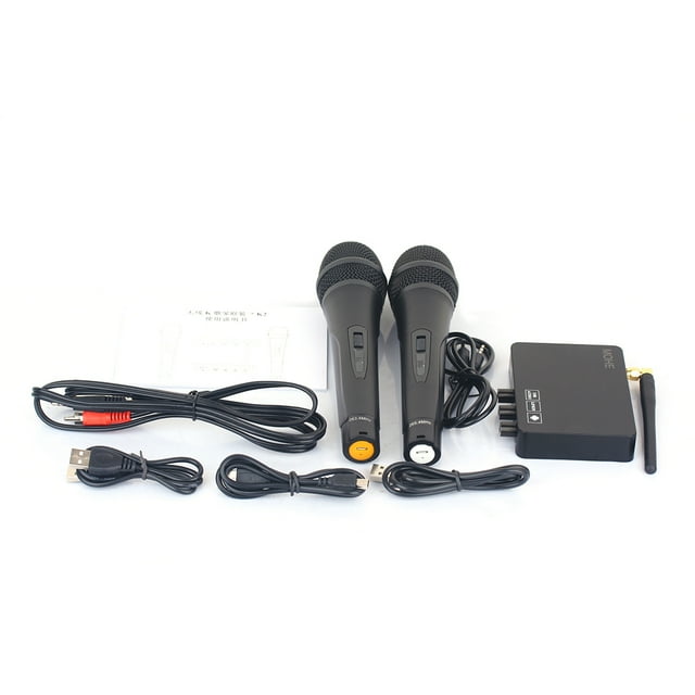 K2 Wireless Mini Family Home Karaoke Echo System featuring a professional wireless microphone system with two handheld microphones, a compact main unit, and various cables including USB, micro USB, and audio connectors. The system is designed for conferences, weddings, karaoke, and other events, offering noise-cancelling technology, adjustable volume controls, and a stable wireless signal. Components are displayed on a white background.