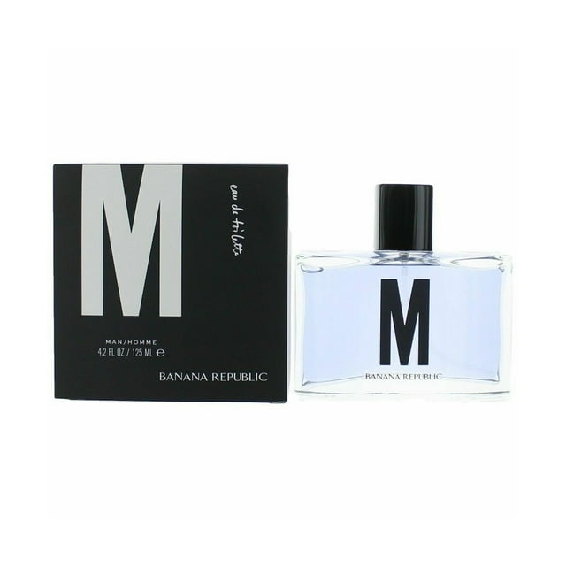 Banana Republic M EDT 4.2 oz / 125 ml Spray For Men. The image displays a sleek rectangular glass bottle with a black cap, marked with a bold 'M' on the front. A matching black box with white 'M' lettering and branding details is positioned next to the bottle. This Eau de Toilette features a refreshing citrus-floral fragrance with bergamot, grapefruit, honeysuckle, and musk, perfect for casual and daytime use.