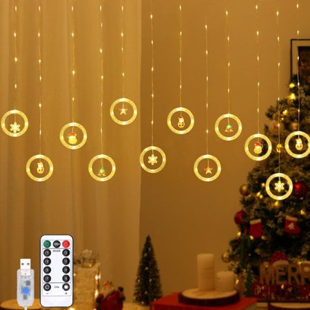 Lewondr 138 LED Christmas Curtain Lights Santa Christmas Tree Star Heart Hanging Home Lights with 6H Timer & 8 Modes Remote & USB Powered Fairy Lights Xmas Decor for Home Party Indoor Warm Light