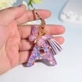 thumbnail image 1 of Llaveros con letras iniciales para mujer, borla, mariposa, rosa, morado, bonito llavero de coche para cartera, monederos, mochila, siete en total, 1 of 5