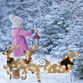 thumbnail image 2 of Las decoraciones navideñas con luces LED iluminan el patio con muñecos de nieve, trineos, alces y pingüinos., 2 of 5