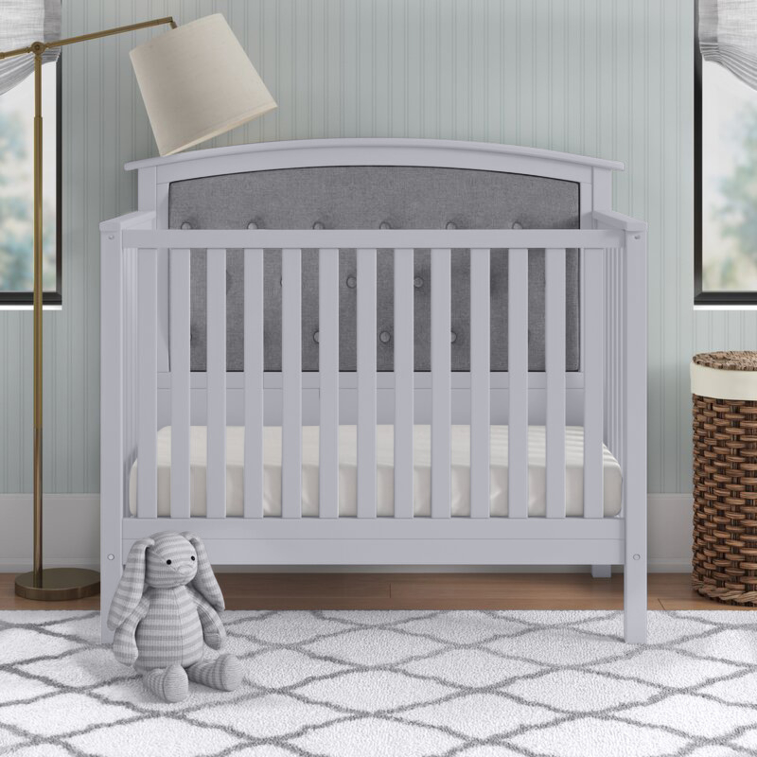 crib with cushion headboard