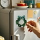 thumbnail image 5 of Mini guirnalda magnética navideña | Decoración festiva para el refrigerador con campanas y estrellas | Pack de 2 coronas de plástico para decorar el hogar y la oficina en Navidad, 5 of 6