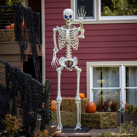 Multicolor Light-Up Eyes Posable Titan Skeleton Standing Halloween Decoration - 10 ft