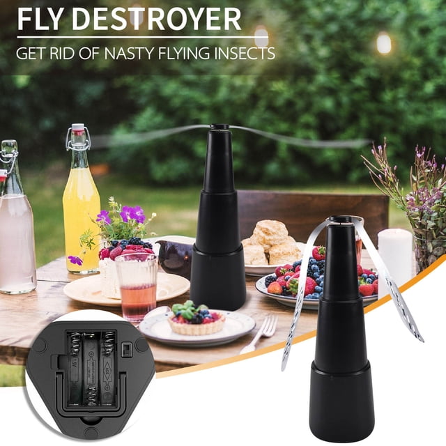 Dvkptbk Mosquito Repellent Portable & Automatic Fly Fan in black with double soft PVC blades, designed to repel flies using light refraction and wind. The fan is displayed on an outdoor dining table with food and drinks, emphasizing its practical use. An inset image shows the battery compartment, which requires 2 AA batteries (not included). Made of ABS material, it has a 15-inch effective range and a hook for hanging or tabletop placement.