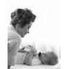 Mother feeding baby with baby bottle Poster Print