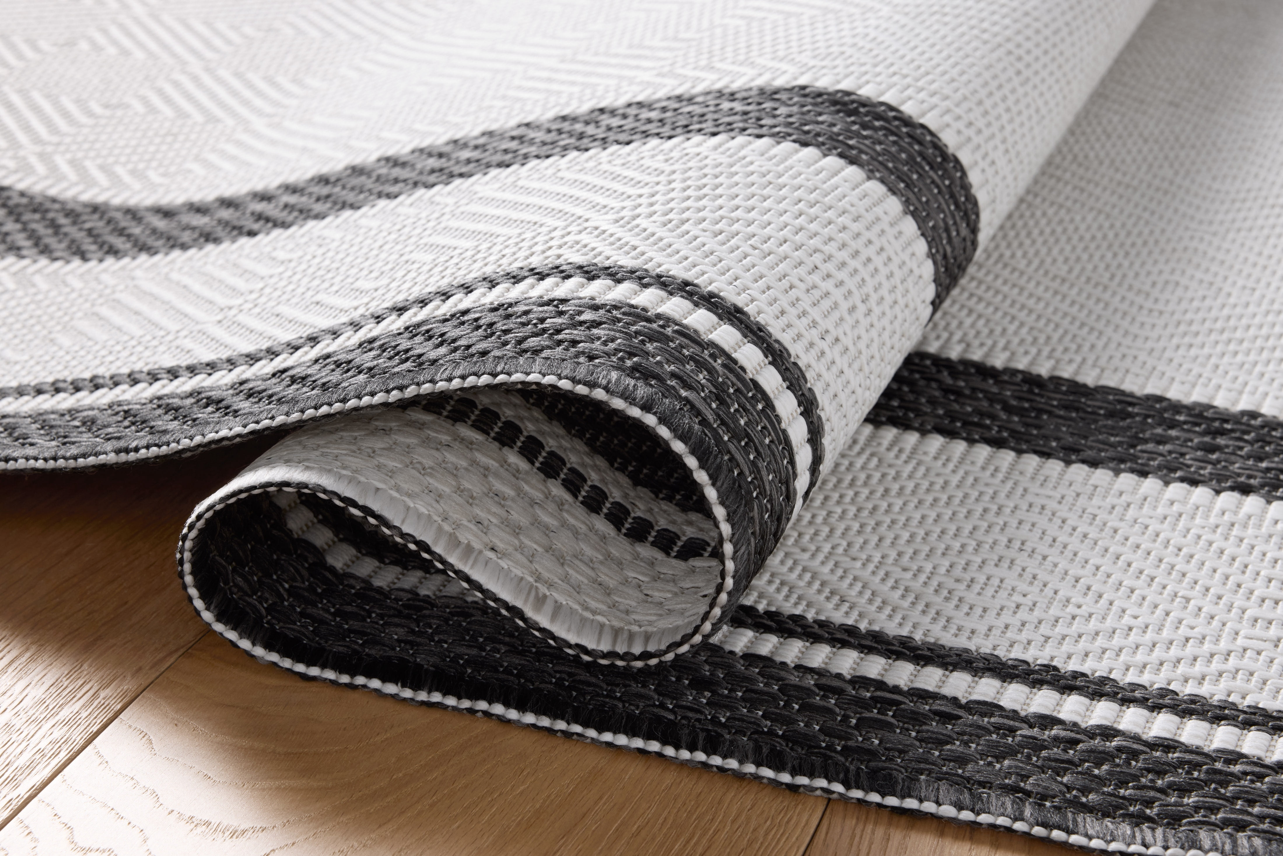 Indoor Outdoor Rug 7x9, Reversible, Loloi Easton Onyx / Ivory (6'7" x 9'4")