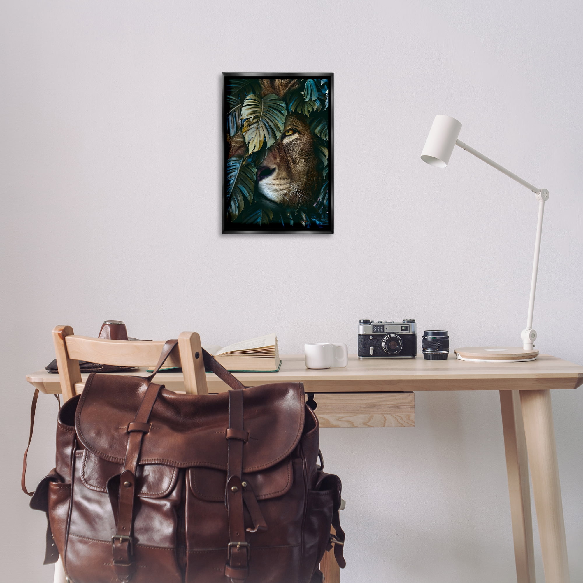Stupell Industries Lion Peering Monstera Leaves Plants & Flowers Painting Black Floater Framed Canvas Art Print Wall Art, 17 x 25
