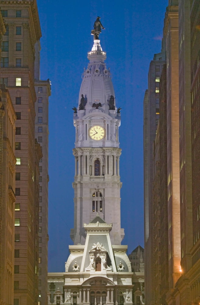 William Penn statue on the top of City Hall at dusk from Broad Street