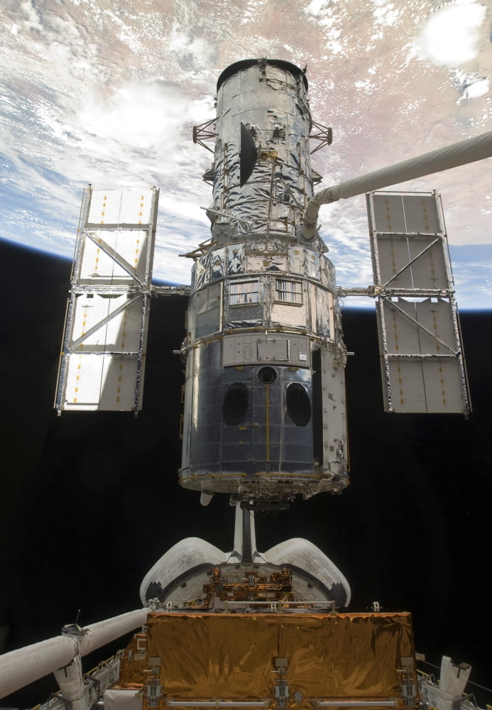 The Hubble Space Telescope is released from the cargo bay of Space Shuttle Atlantis Canvas Art - Stocktrek Images (24 x 34)