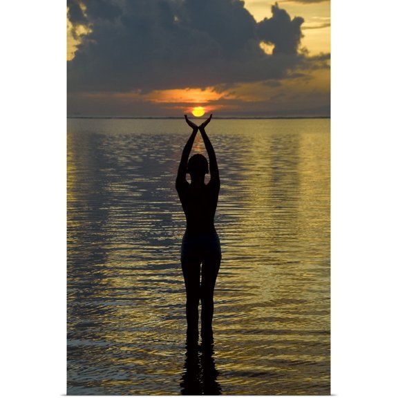 Great BIG Canvas | "Indonesia, Bali. Woman silhouetted at sunrise on Sanur Beach" Art Print - 16x24