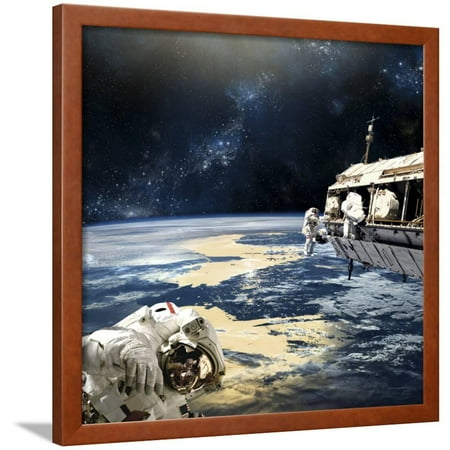Astronauts Working on Space Station While Orbiting an Earth-Like Planet Framed Print Wall Art By Stocktrek