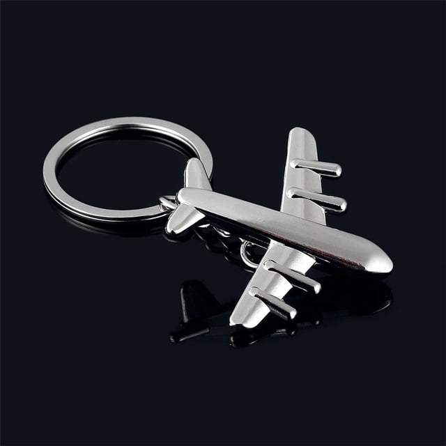 Riforla Porte-clés Avion Modèle 3D Classique en Argent, Présentant un design d'Avion miniature Détaillé Attaché à un Anneau de Clé Circulaire. Fabriqué en Métal avec une Finition Polie, Ce Porte-Clés Est à la Fois Décoratif et Fonctionnel, Idéal pour des Accessoires de Voyage Ou comme Cadeau.