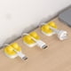 thumbnail image 4 of Pack de 6 clips para cable • Organizador de gestión de cables de sobremesa • Abrazaderas para cables de carga y datos • Portacables adhesivos (negro, blanco, gris, verde, amarillo), 4 of 6