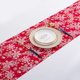 thumbnail image 1 of Decoración navideña vibrante con mantel rojo con copos de nieve, 1 of 7
