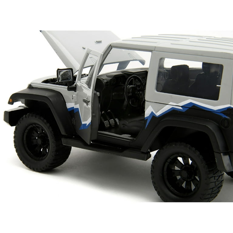 2007 Jeep Wrangler Gray and Black with Blue and White Stripes with Extra Wheels Just Trucks Series 1/24 Diecast Model Car by Jada 2007 Jeep Wrangler Gray and Black with Blue and White Stripes with Extra Wheels Just Trucks Series 1/24 Diecast Model Car by Jada